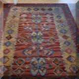 D57. Indian hand tufted wool rug. 5' x 8' 